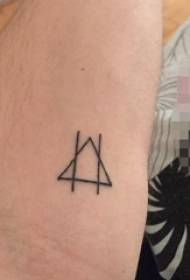 Schoolgirl thighs on black line geometric element tattoo picture