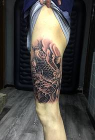 Small squid tattoo picture covering the thigh
