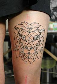 Male lion tattoo on girl's legs