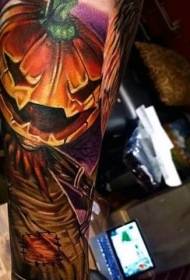 Arm new style colored crow with pumpkin tattoo pattern