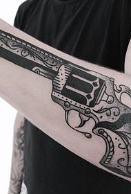 Arm pistol point black gray tattoo pattern