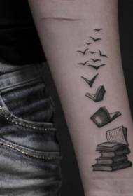 Pale book with bunch of bird tattoos