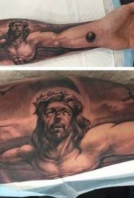 Arm religious crucifixion of Jesus tattoo