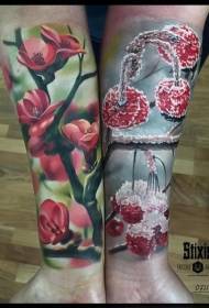 Arm realistic style of colorful cherry tree with cold cherry tattoo