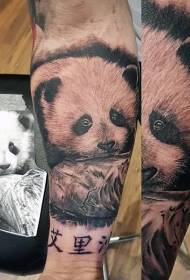 The arm is a very beautiful and cute panda baby tattoo pattern