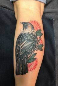 blauzdos spalvota paukščio tatuiruotė ant šakos