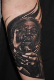 Arm realistic portrait of famous guitarist tattoo