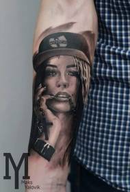 Portrait of woman in brown brown hat with tattoo pattern