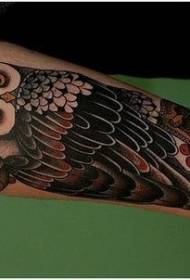 Arm color owl tattoo pattern