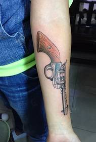 female arm pistol tattoo