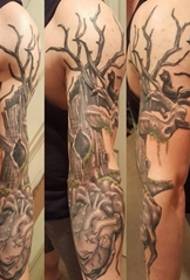 male arm on black gray mechanical heart tattoo and Tree tattoo picture