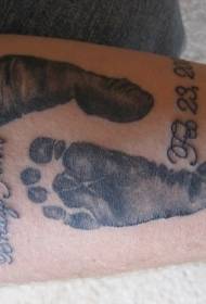 black child footprints and alphanumeric tattoo pattern