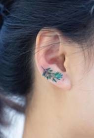 a group of ultra-simple small art tattoos on the ears