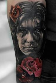 woman's face with a flower with a colorful tattoo pattern