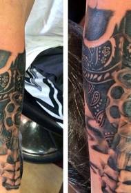 arm cool black gray style skull with revolver tattoo pattern