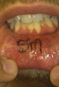 two letter tattoo pattern inside the lips