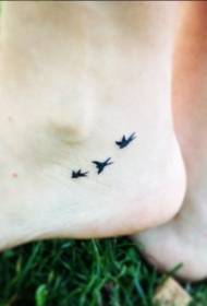 small fresh swallow tattoo pattern on the little girl's feet
