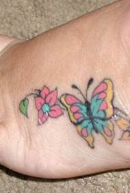 female instep color pansy tattoo pattern