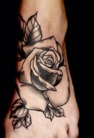 black and white block rose tattoo pattern on the instep