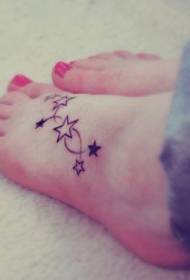simple star tattoo on the instep of the beautiful girl