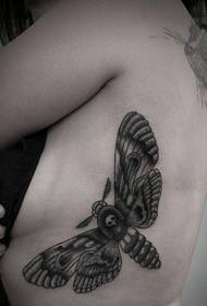 women Handsome black-gray moth tattoo picture on the left side rib