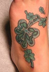 foot colored green clover tattoo pattern