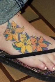 female feet colored beautiful flower tattoo pattern