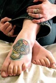 female instep color skull tattoo pattern
