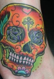 colored sugar skull tattoo on the instep