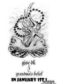 Zdjęcie tatuażu dłoni krzyż skrzydła