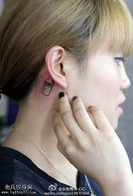 female ear behind small fresh bottle tattoo pattern
