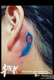 girls ear small hand-colored feather tattoo pattern