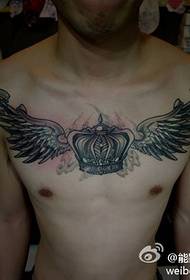 handsome cool crown and wings tattoo pattern on the man's chest