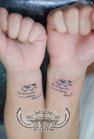 couple arm small elephant English tattoo