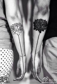 lotus tattoo pattern on the couple's arm