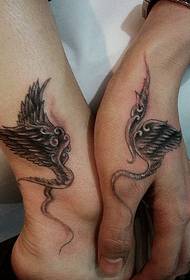 a couple tattoo lovers wings tattoo