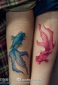 a couple of beautiful little goldfish tattoo designs