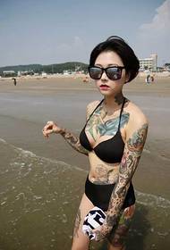 seaside sexy beauty covered body Totem tattoo picture
