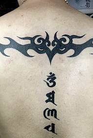 Sanskrit and totem tattoo tattoo together