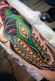 Arm old school cartoon prickly colored crocodile with dagger tattoo pattern