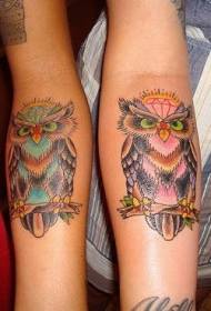 Different color owl arm tattoo pattern