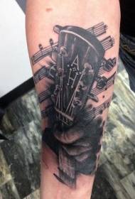 Black and white guitar with musical notes arm tattoo pattern
