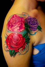 Female shoulders with bright rose tattoo pattern
