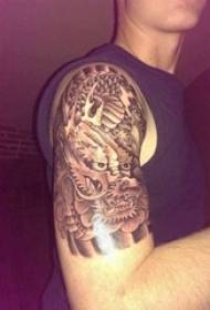 Boy arm on tattoo black and white gray style prick tattoo tattoo dragon tattoo animal tattoo picture