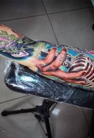Arm very realistic color retro microphone with hand tattoo pattern