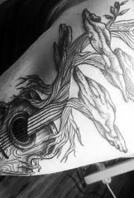 Unique black half guitar half tree arm tattoo pattern