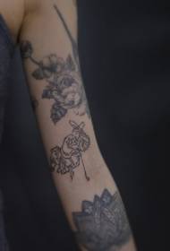 Arm realistic flower with simple portrait tattoo pattern