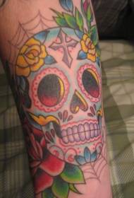 Färgrik tatueringsmönster för skalleros på armen