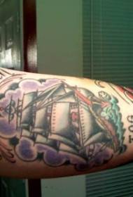 Painted sailboat and letter tattoo on the inside of the boom