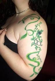 Green vine tattoo pattern on shoulders and arms